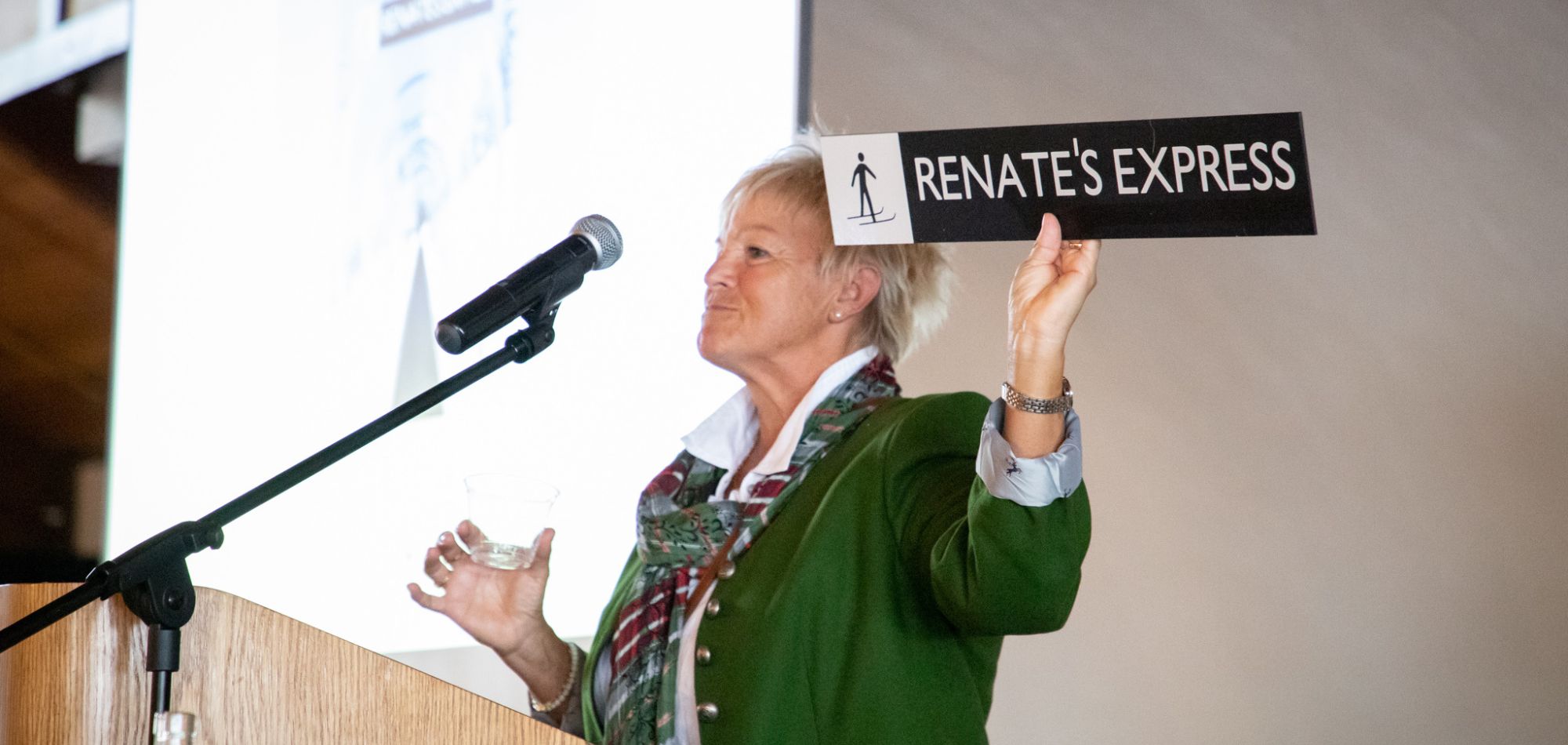 Renate holding sign to Renate's Express